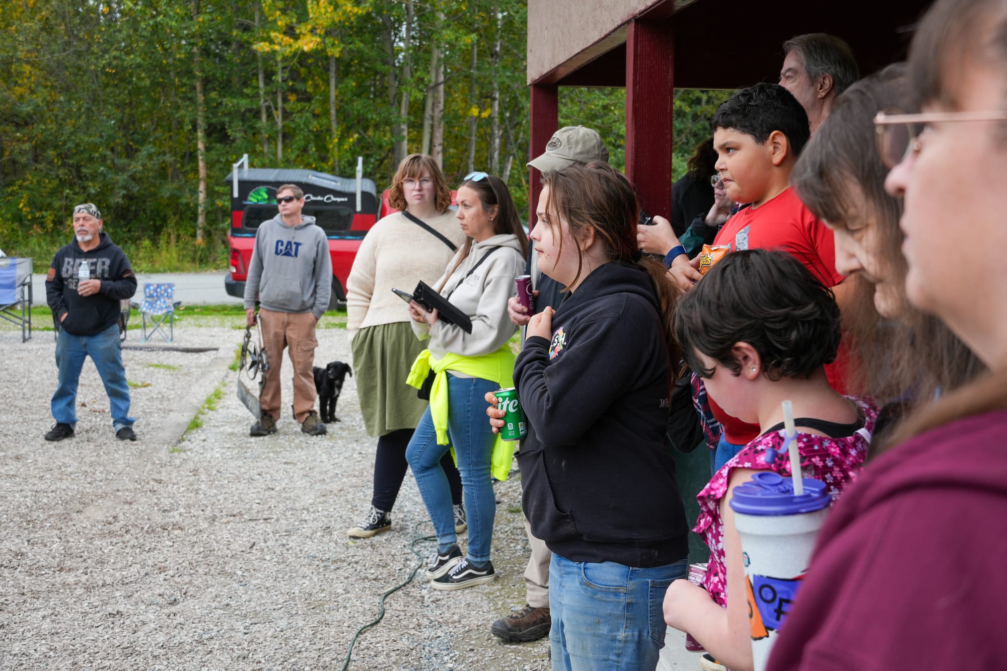 Residents listen to a neighborhood clean-up plan in Williwaw