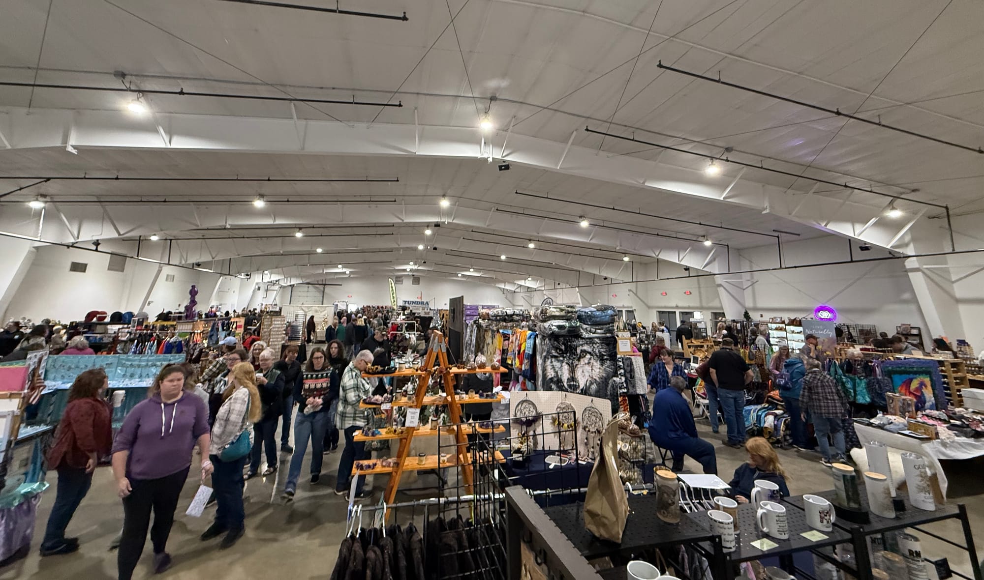 Attendees enter Raven Hall at the Alaska State Fairgrounds