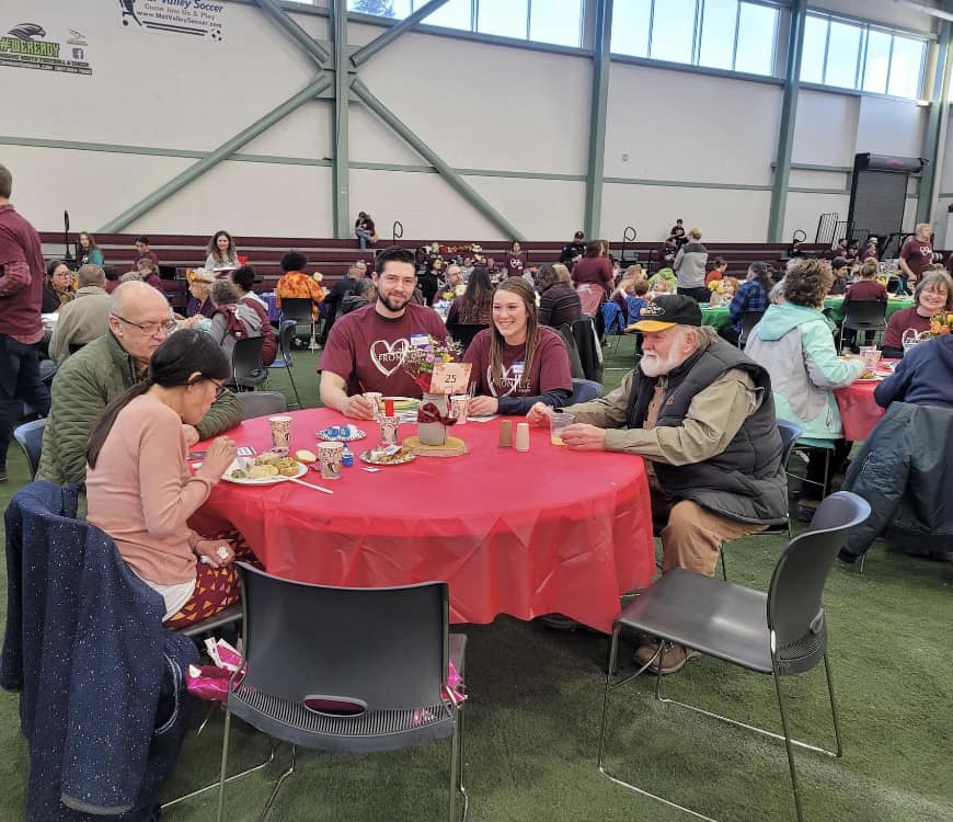 Volunteers and community members gather at Frontline Mission's annual Thanksgiving dinner