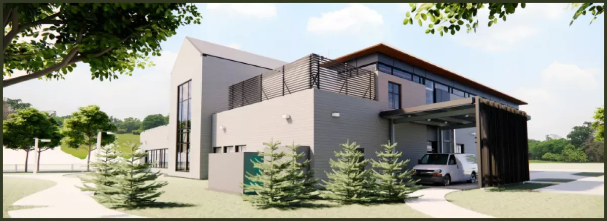 The (left) side, with the two-story window under the gabled roof, faces the two-story white Borough building.