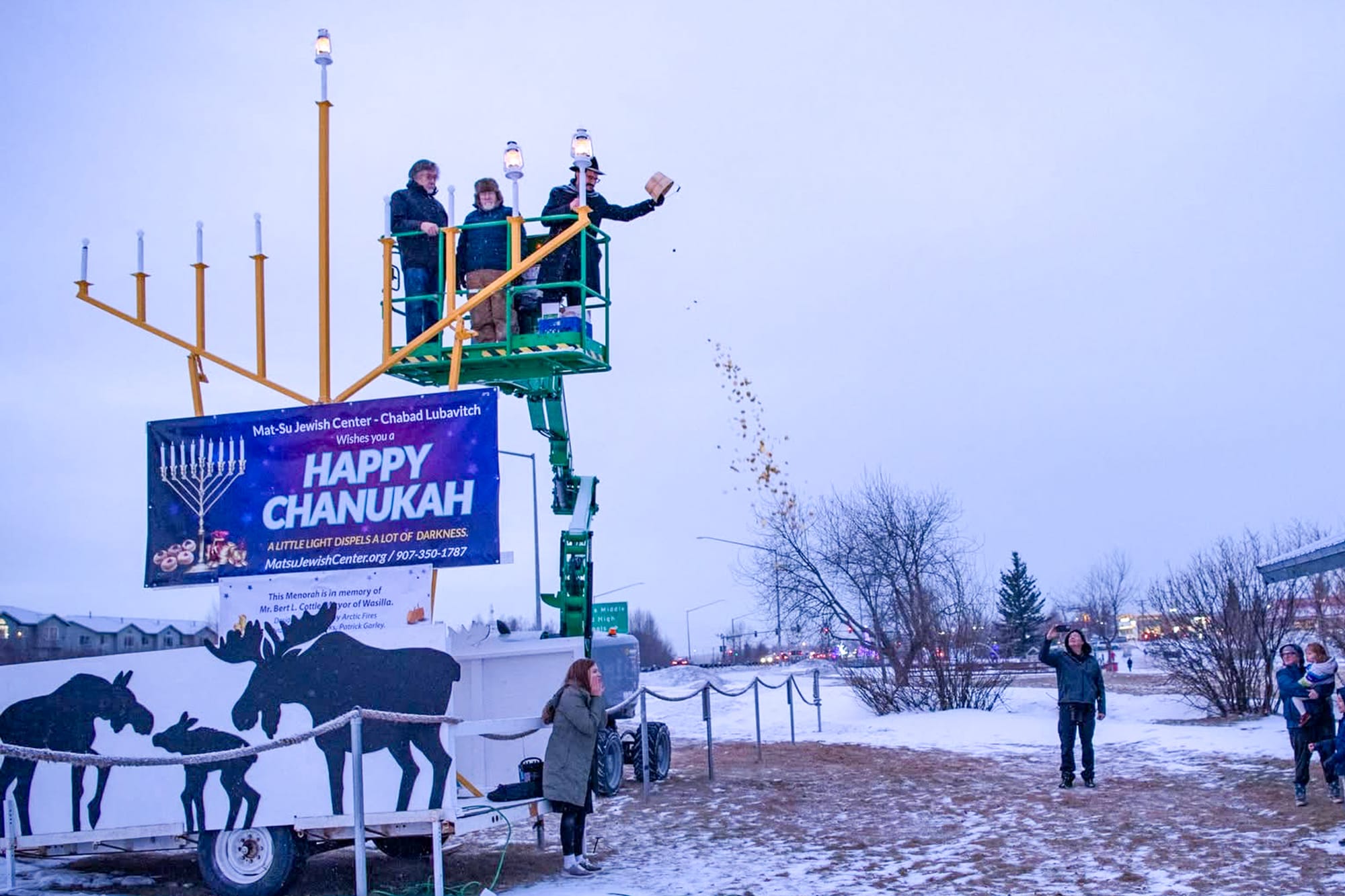 Spectators watch the menorah lighting ceremony in 2024 alongside Wasilla Lake.
