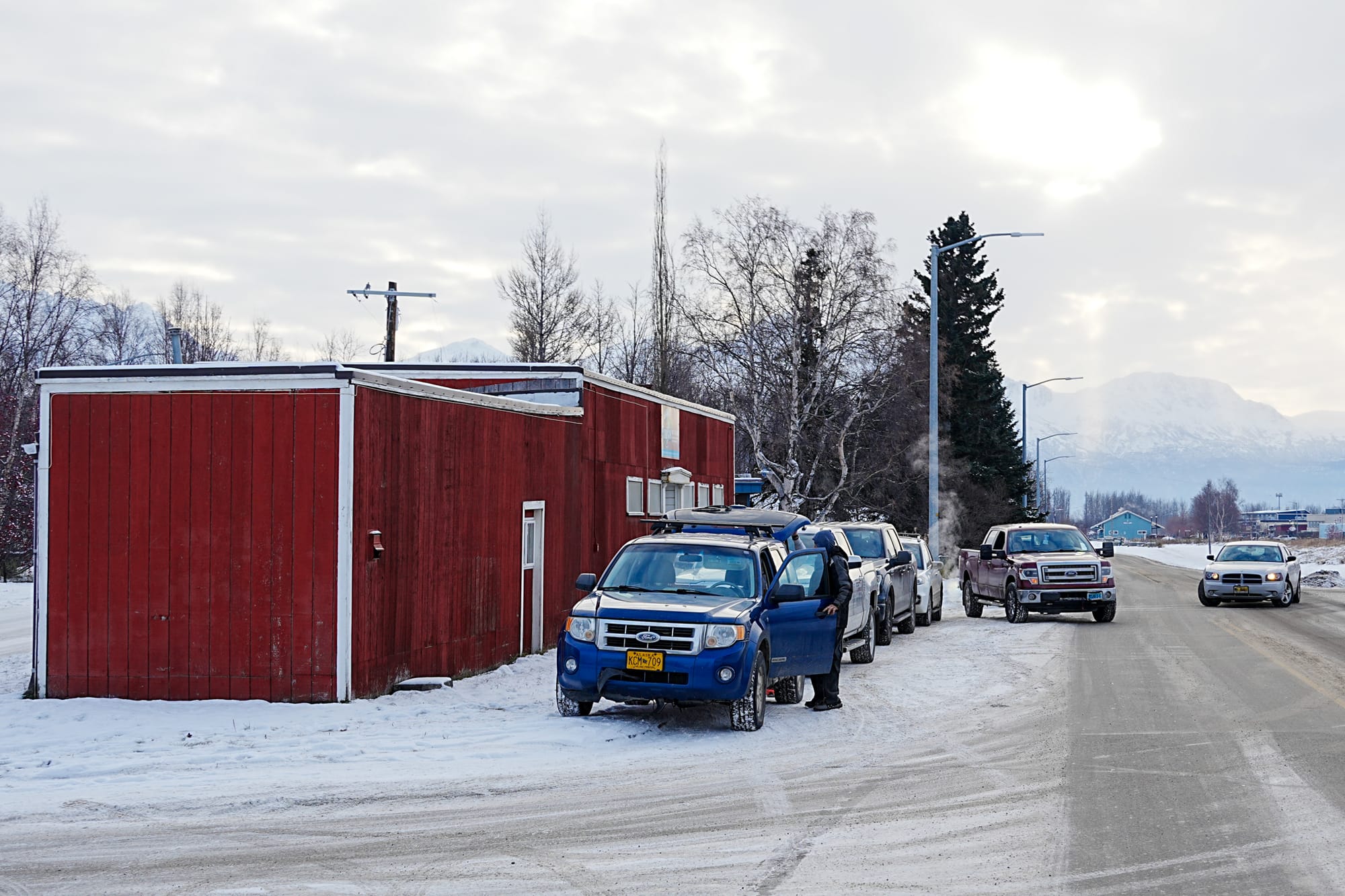 Clients line up outside the Palmer Food Bank's longtime facility on S. Valley Way