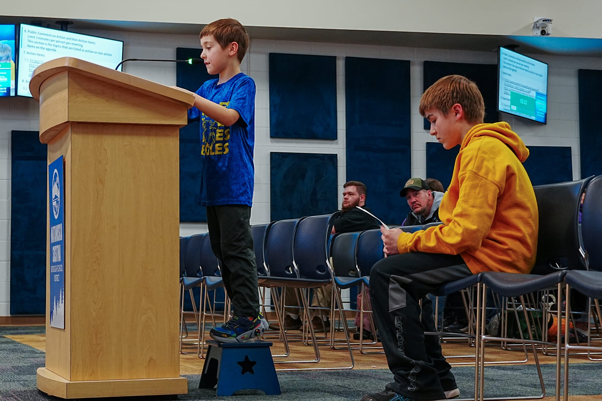 Nathan Merrill, 7, speaks before the school board