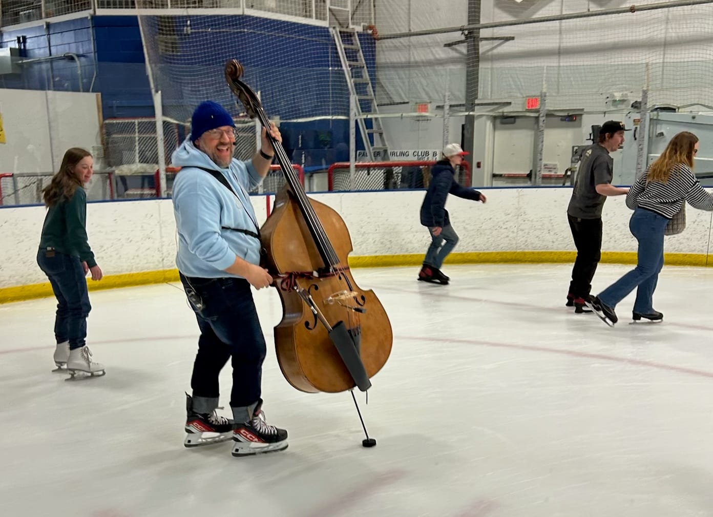 The Super Saturated Sugar Strings bass player Kevin Worrell performs on skates