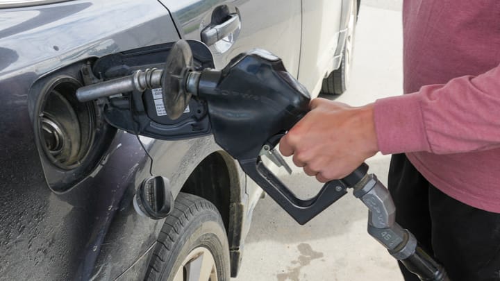 A borough residents puts gas in their vehicle at a Shell station 