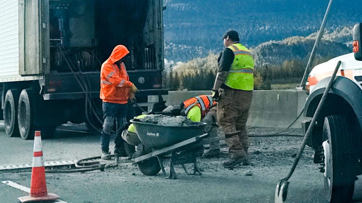 State crews repair concrete against the Matanuska River bridge