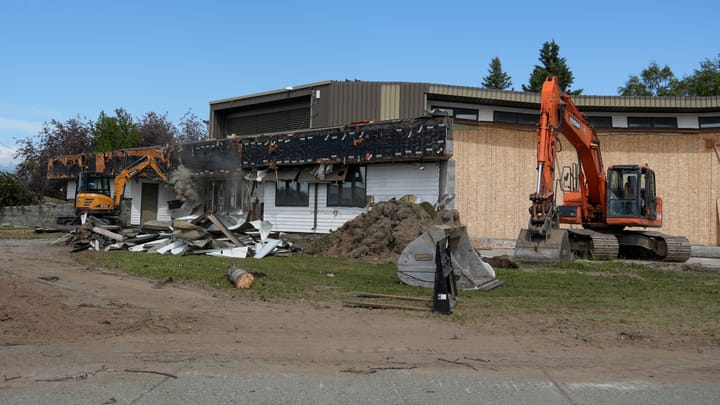 Crews salvage portions of the Palmer Public Library roof as part of the building demolition project