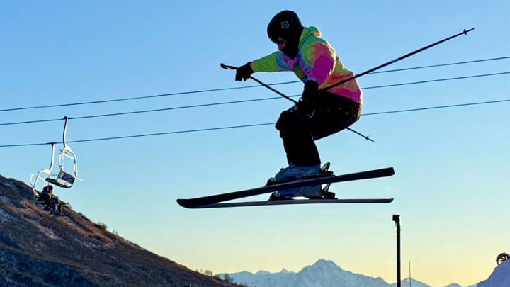 A skier hits a jump at the Skeetawk ski area's terrain park