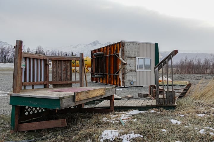 A trailer sits flipped on its side in The Ranch subdivision near Wasilla 